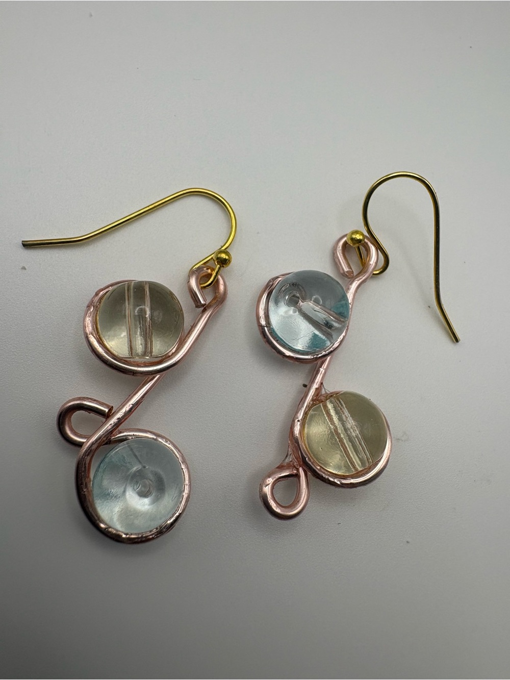 Handcrafted Rose Gold and Gold Drop Earrings with Blue-Green Glass Accents